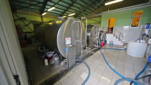 Workshop in the dairy farm with chrome tanks for milk. — Stock Video