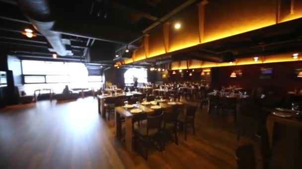 Entering and overview roomy hall with furniture at restaurant. — Stock Video