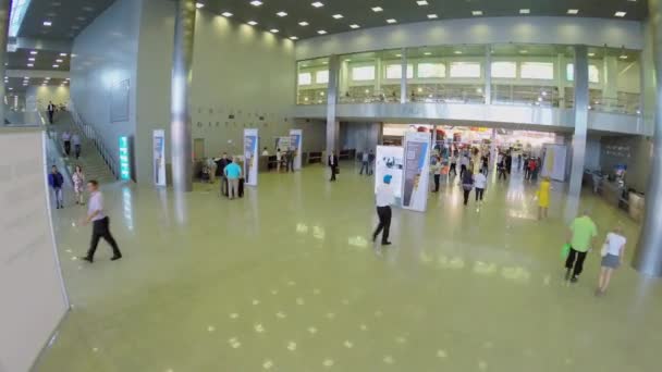 People walk during International Specialized Exhibition CET 2014 — Stock Video