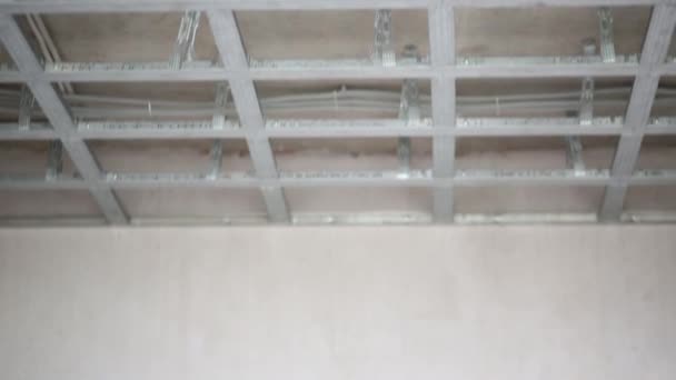 Ceiling frame made of profile and finished hung ceiling — Stock Video