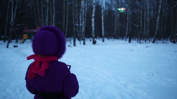 Girl controls of Dji Phantom with gopro in flight taking photos — Stock Video