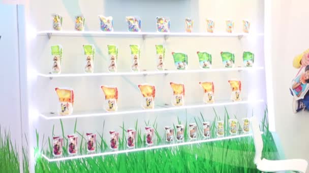 Shelves with samples of dairy products at Exhibition — Stock Video