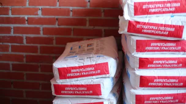 Bags of dry mortar Knauf — Stock Video