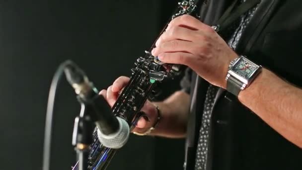 Hands man playing in flute and microphone — Stock Video
