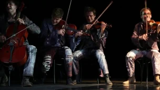 Violinists quartet sit and play music — Stock Video