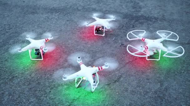 Four quadrocopters with rotating propellers — Stock Video
