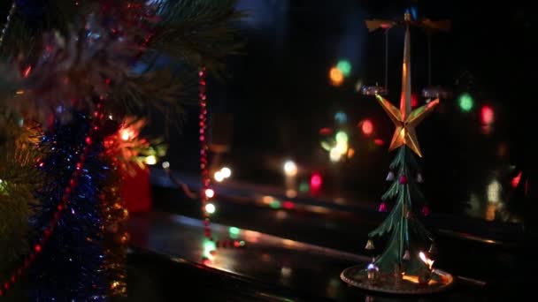 Toy tree with bells on black piano — Stock Video