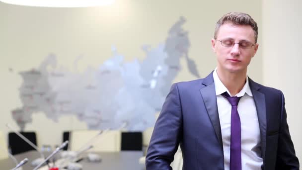 Young businessman in glasses at meeting room. — Stock Video