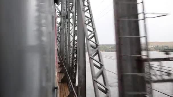 Railway and iron bridge from moving train — Stock Video