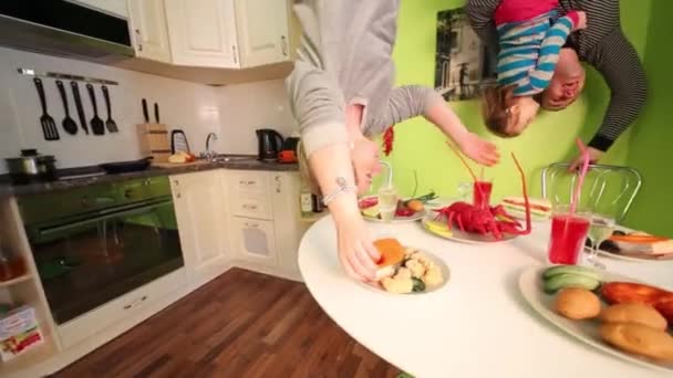 Father, mother and daughter in inverted house — Stock Video