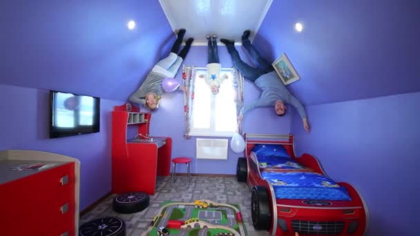 Father, mother, daughter in inverted house — Stock Video