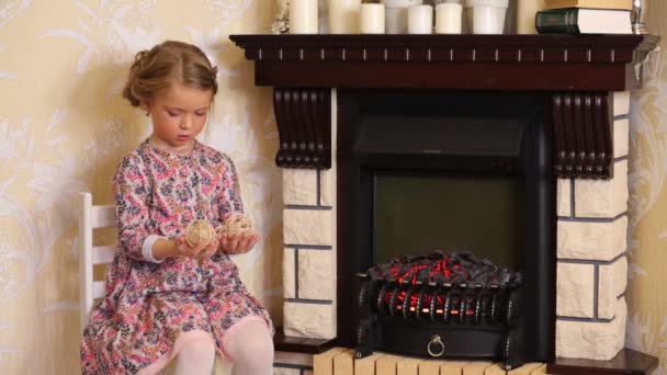 Little cute girl with straw balls — Stock Video