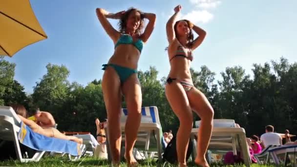 Two happy women in swimsuits dance — Stock Video