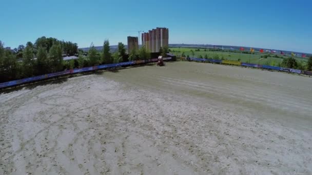 Tractor prepares equestrian arena — Stock Video