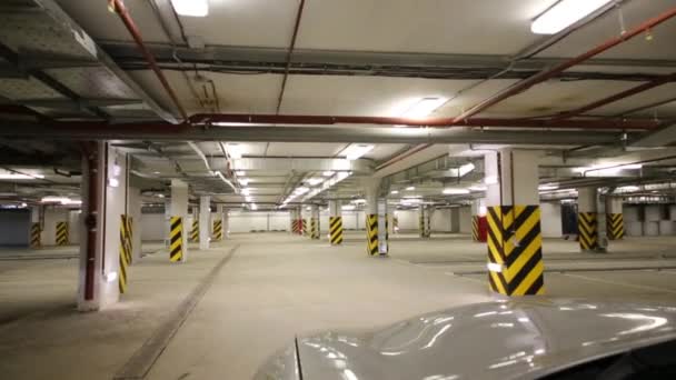 Car moves in underground car parking — Stock Video