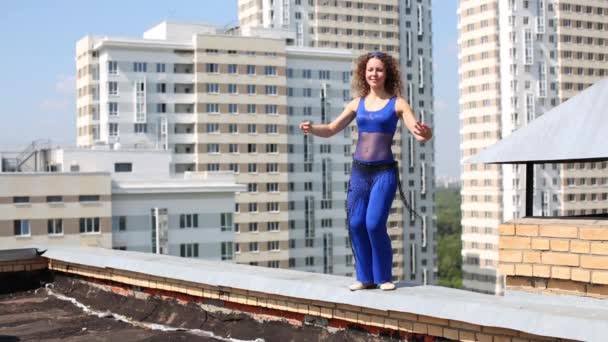 Woman dancing belly dance on roof — Stock Video