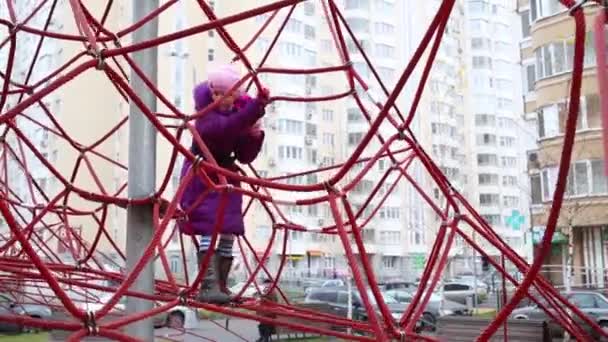 Little girl plays at playground — Stock Video