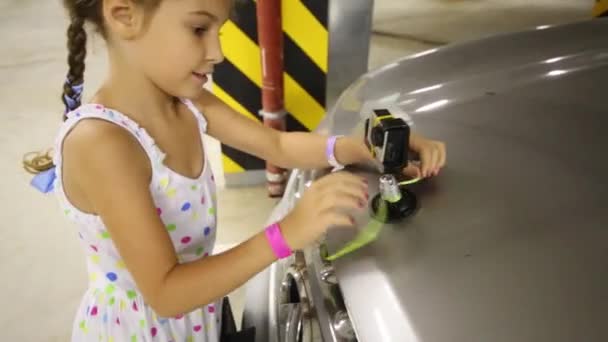 Girl tying the ribbon at the camera — Stock Video