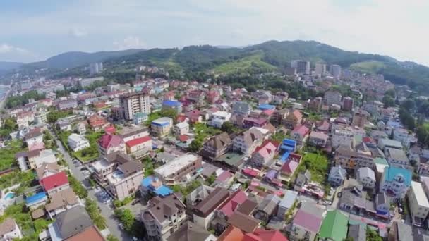 Coastal town near mountains — Stock Video