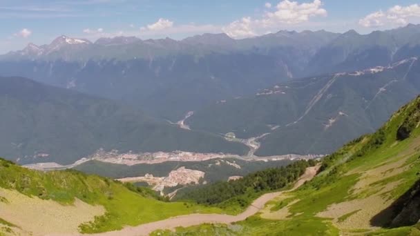 Townscape at foot of mountains on summer day — Stock Video