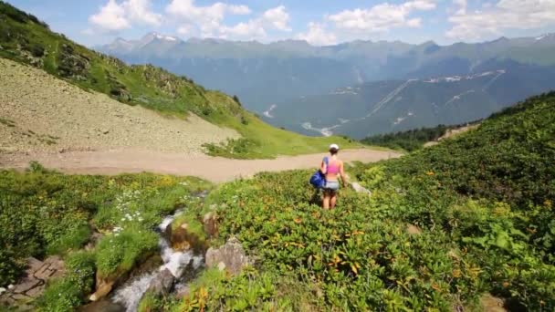 Woman going in mountains — Stock Video