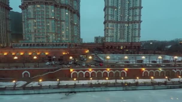 Residential complex on quay of icy river — Stock Video