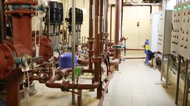 Complex system of pipes of heating supply for residential buildings — Stock Footage Complex system of pipes of heating supply for residential buildings Royalty Free Stock Footage