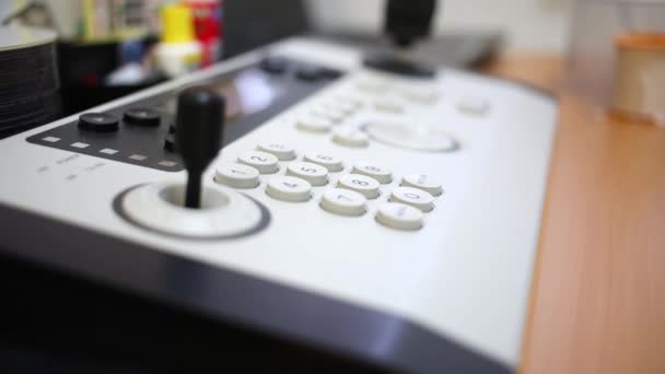 Remote control panel with joystick and ring at desk — Stock Video