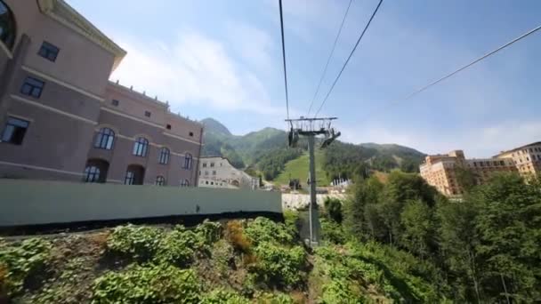 Movement on funicular above mountains — Stock Video