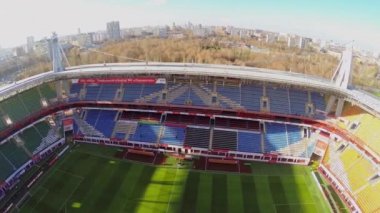 Cityscape and empty tribunes on football stadium 