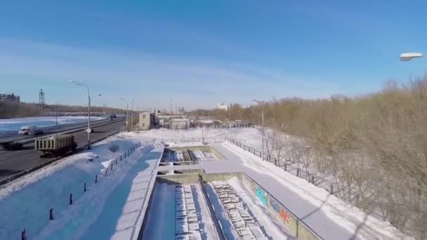 Road traffic near snow melting station — Stock Video