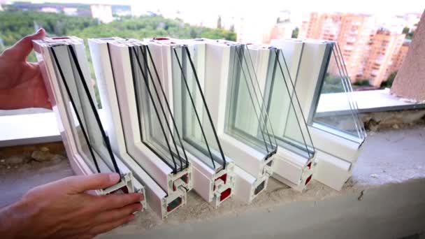 Hands take one of windows samples — Stock Footage Hands take one of windows samples Royalty Free Stock Video