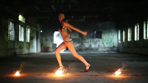 Girl dances next to burning sparklers — Stock Video