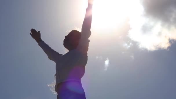 Girl raises hands and smiles — Stock Video