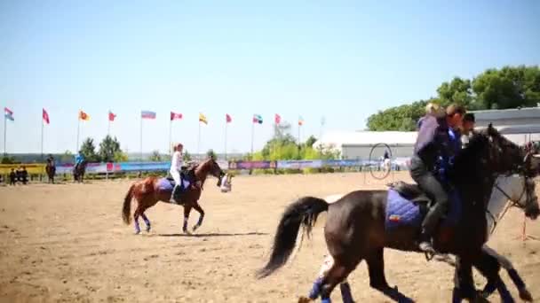 Two riders hold bar — Stock Video