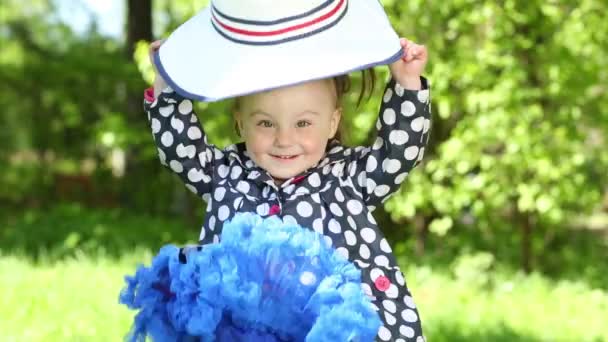 Happy little girl wears hat — Stock Video