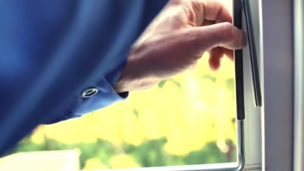 Male hands mount weatherstrip seals — Stock Footage Male hands mount weatherstrip seals Stock Video