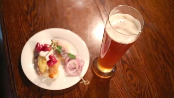 Male hand taking glass with beer — Stock Video