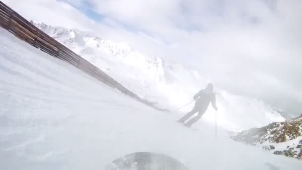 Snowboarder moves down on ski route — Stock Video