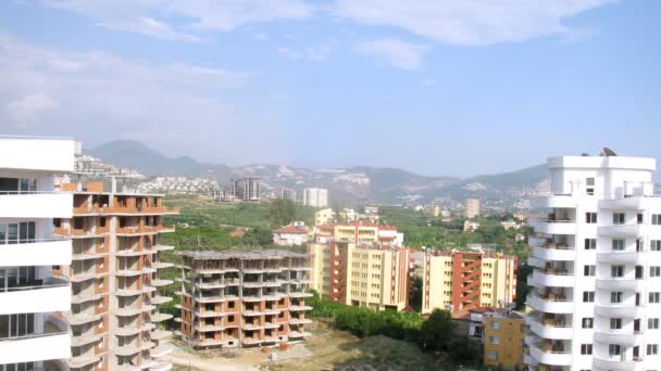 New buildings against mountain landscape — Stock Video