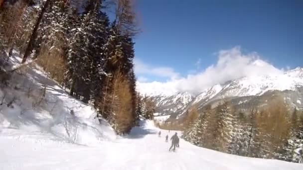 Skiers go down from mountain — Stock Video