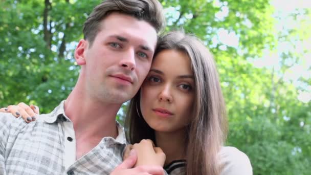 Young couple look and smile — Stock Video