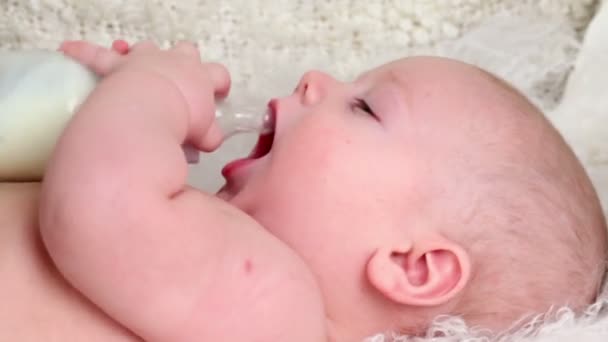 Little baby boy drinks milk — Stock Video