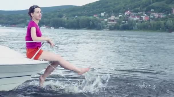 Woman sits on boat — Stock Video