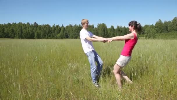 Guy with girl turning around — Stock Video