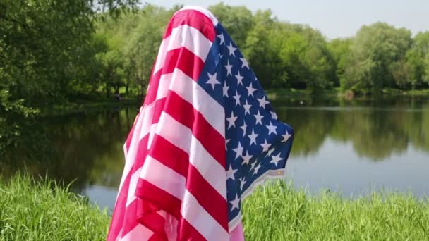 Little girl wrapped with US flag — Stock Video