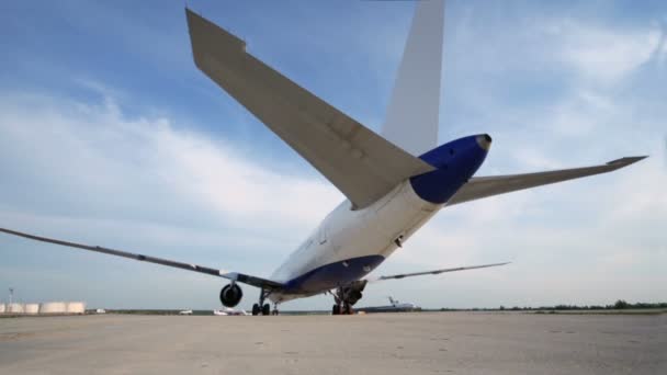 Airliner stands on runway of airdrome — Stock Video