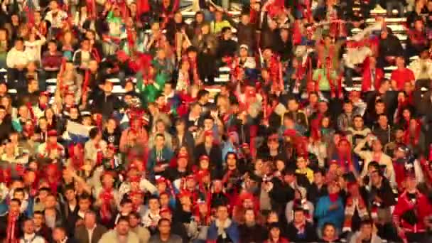 Russian fans sit on tribune with flags — Stock Video