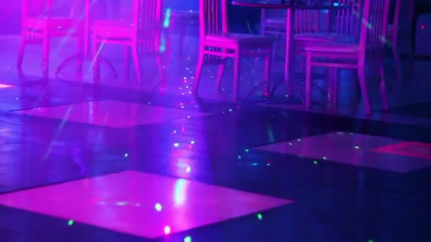Laser spots moves on dance floor — Stock Video