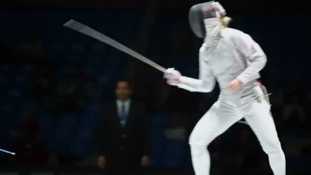 Duel of sportswomen on championship of fencing — Stock Video